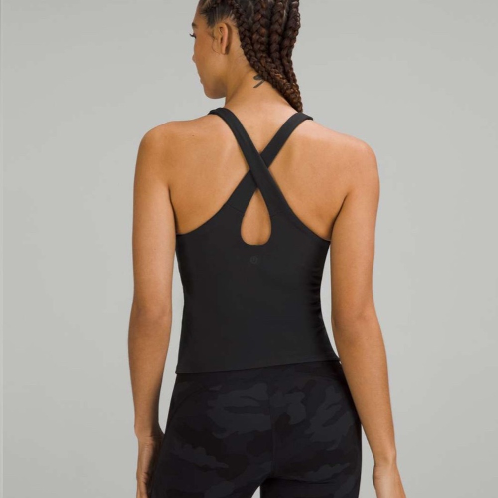 Lulu Key to Balance yoga top. Size 4. Perfect condition. Built in bra. Above hip
